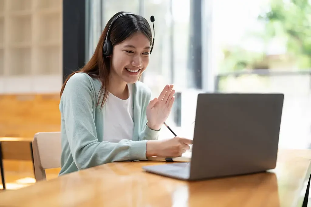 glotty_smiling-girl-student-wear-wireless-headphone-study-online_paidika glotty english